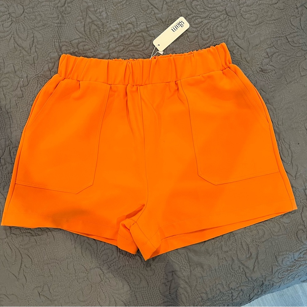 High waist elastic Glam orange shorts with large front pockets—size Large